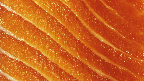A side of cold-smoked salmon sliced to show its translucent colour and marbling