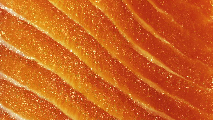 A side of cold-smoked salmon sliced to show its translucent colour and marbling